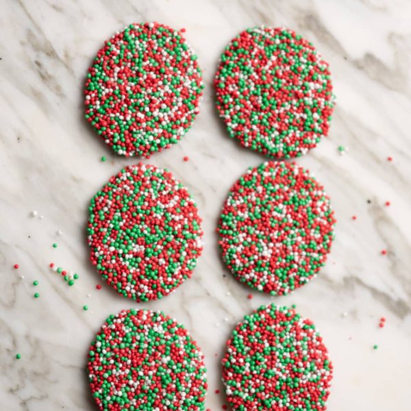 Milk Choc Christmas Speckle 12x300g - in a Stand Up Bag With Bow_image_Just Sweets_order now